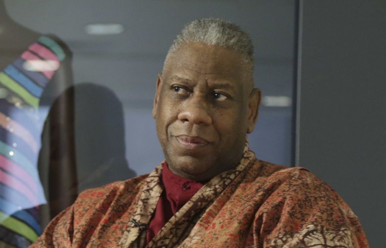FILE – André Leon Talley, a former editor at large for Vogue magazine, speaks to a reporter at the opening of the “Black Fashion Designers” exhibit at the Fashion Institute of Technology in New York, Tuesday, Dec. 6, 2016. Talley, the towering former creative director and editor at large of Vogue magazine, has died. He was 73. Talley’s literary agent confirmed Talley’s death to USA Today late Tuesday, Jan. 18, 2022. (AP Photo/Seth Wenig, File) NYET950 NYET950