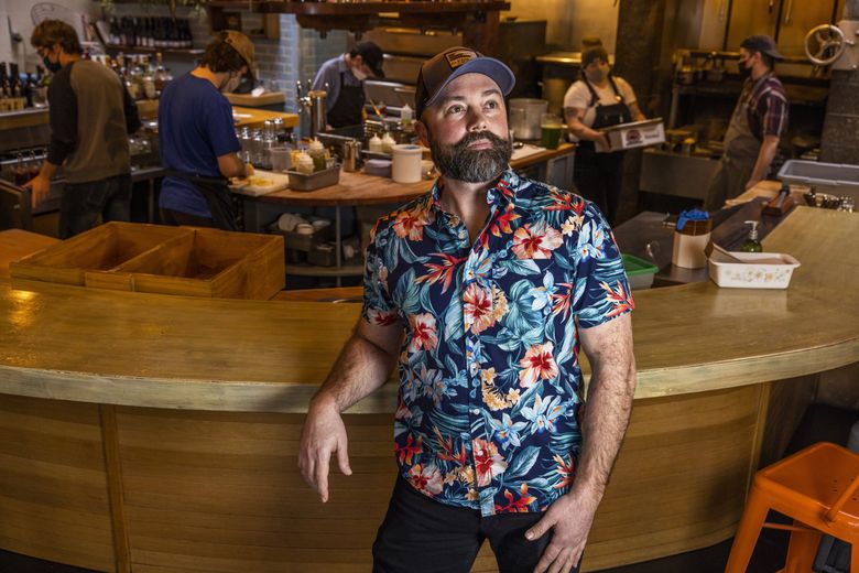 Joe Sundberg, co-owner of Seattle’s Manolin restaurant, is facing a labor shortage that won’t let up. “We are probably about 80% of what we were before. And a lot of that staffing that’s not here right now is the higher-ranking people: managers, shift supervisors,” he said.  (Daniel Kim / The Seattle Times)