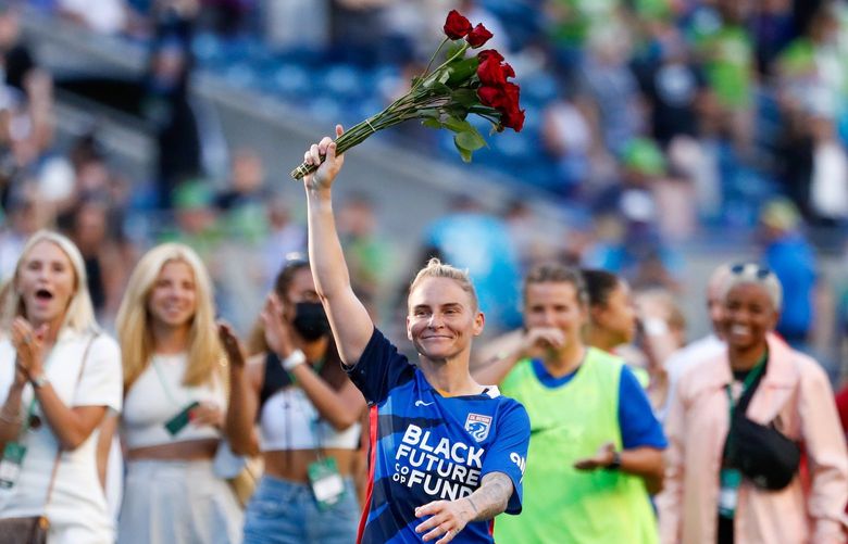 Lumen Field – OL Reign vs. Portland Thorns – 082921
OL Reign midfielder Jess Fishlock holds a bouquet of roses after a win against the Portland Thorns FC Sunday, Aug. 29, 2021, in Seattle, Wash. 218052