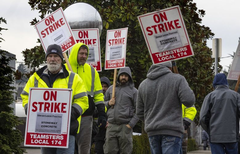 On Friday, January 14, 2022, striking concrete mixer truck drivers with Local #174 picket in front of Stoneway Concrete headquarters, located at  9125 10th Ave. S, Seattle.   The strike has halted some construction projects across the region.

 219335