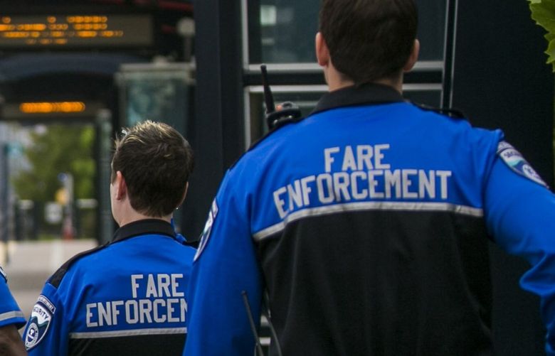 Fare Enforcement officers walk the platform at SODO station for Sound Transit’s Link Light Rail Monday July 7, 2014. Last week, three fare enforcement officers apprehended three men who had not paid their fares, and called for backup from Sound Transit police, which are King County Sheriff’s deputies on contract to patrol Sound Transit transportation. One of the men pulled a gun on the deputy and was fatally shot in exchange.

139945
