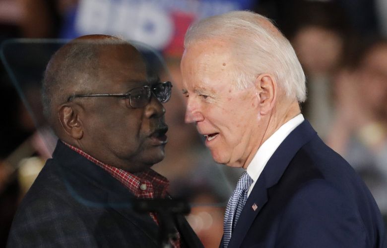 Then-Democratic presidential candidate Joe Biden talks to Rep. James Clyburn, D-S.C., at a primary night election rally in Columbia, S.C., Feb. 29, 2020 after winning the South Carolina primary. President Biden has frequently referenced the critical role South Carolina played in his nomination. He points to his decades-long relationship with the state whose Black voters handed him a major win at a desperate time for his Democratic campaign. But, in recent interviews with The Associated Press, some Black voters in South Carolina who supported Biden reluctantly â€” or not at all â€” say theyâ€™re unimpressed and even dispirited. (AP Photo/Gerald Herbert) NYPS210 NYPS210