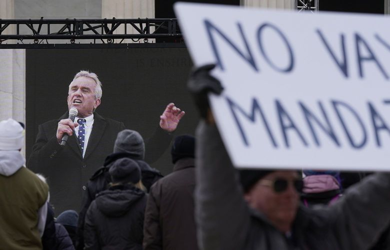 Robert F. Kennedy Jr., is broadcast on a large screen as he speaks during an anti-vaccine rally in front of the Lincoln Memorial in Washington, Sunday, Jan. 23, 2022. (AP Photo/Patrick Semansky) DCPS117 DCPS117