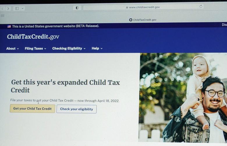 The government website childtaxcredit.gov is photographed on a computer screen Monday, Jan. 24, 2022, in Annapolis, Md. The IRS has launched a revamped Child Tax Credit website meant to steer people to free filing options for claiming the credit. The website includes a new tool that will help filers determine their eligibility and how to get the credit. (AP Photo/Susan Walsh) DCSW301 DCSW301