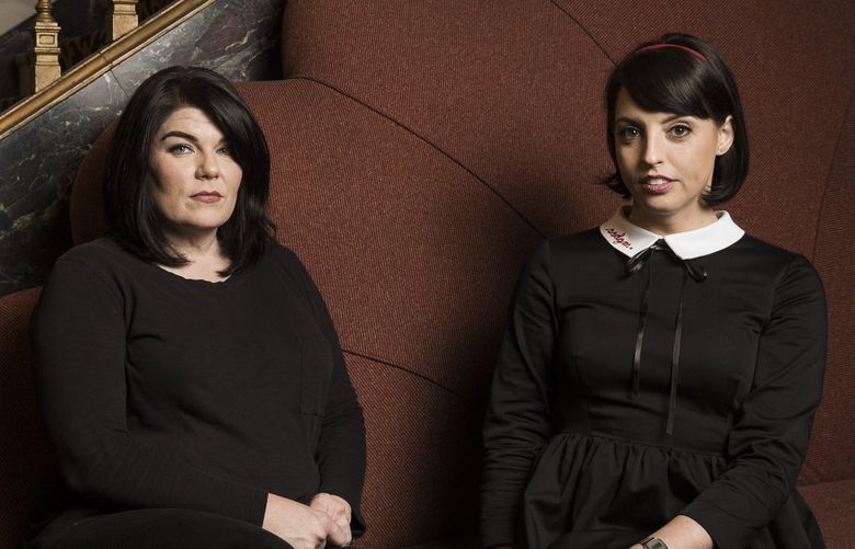 — PHOTO MOVED IN ADVANCE AND NOT FOR USE – ONLINE OR IN PRINT – BEFORE MAY 20, 2018. — Karen Kilgariff, left, and Georgia Hardstark, hosts of the podcast “My Favorite Murder,” at the Orpheum Theater in Los Angeles, March 16, 2018. Hardstark and Kilgariff are part of a new breed of superstar podcasters who have cultivated a groupie-like fan base that will follow them to live performances. (Emily Berl/The New York Times)