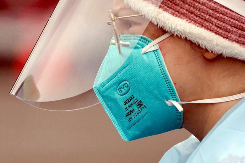 The CDC has clarified that properly fitted N95 and KN95 masks offer the most protection. (Ted S. Warren / The Associated Press)