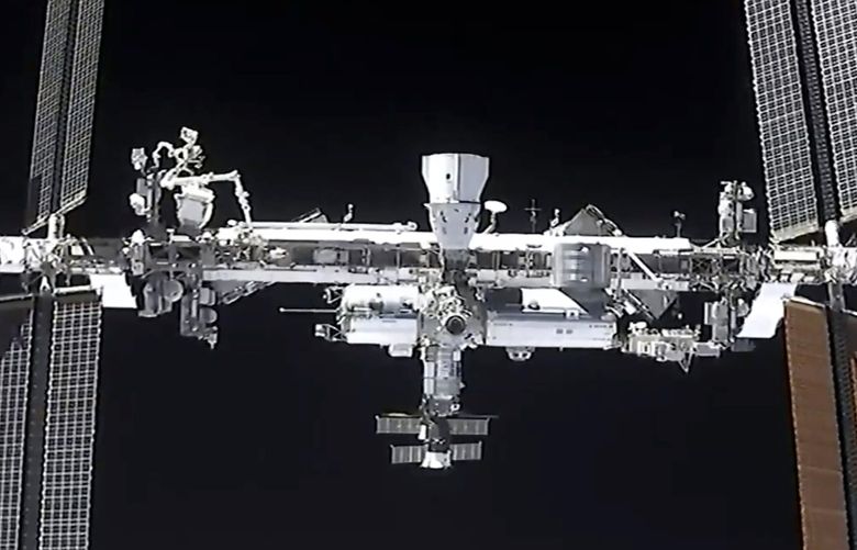 NASA called off a spacewalk on Nov. 30, 2021, because of space junk that could puncture an astronaut’s suit or damage the International Space Station. Shown is a view of the International Space Stationfrom the SpaceX Crew Dragon spacecraft on April 24, 2021. (NASA via AP, File)