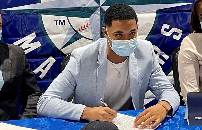 Federik Jimenez, center, is a right-handed pitcher out of the Dominican Republic.