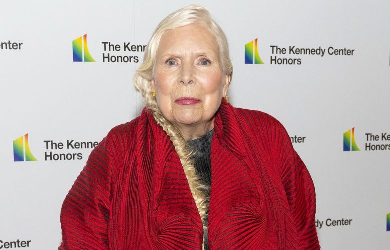 2021 Kennedy Center honoree singer-songwriter Joni Mitchell poses on the red carpet at the Medallion Ceremony for the 44th Annual Kennedy Center Honors at the Library of Congress, on Saturday, Dec. 4, 2021,  in Washington. (AP Photo/Kevin Wolf) DCKW105