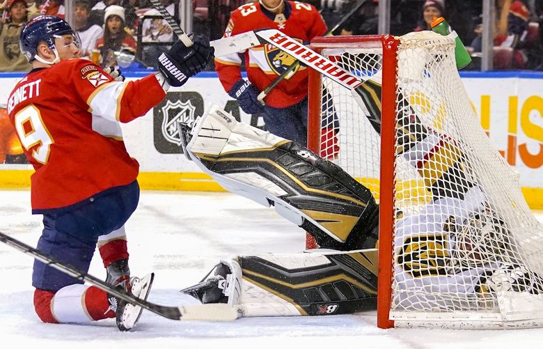 Florida Panthers center Sam Bennett (9) runs into Vegas Golden Knights goaltender Robin Lehner, right, during the second period of an NHL hockey game, Thursday, Jan. 27, 2022, in Sunrise, Fla. Bennett was penalized for goalie interference on the play. (AP Photo/Lynne Sladky) OTK