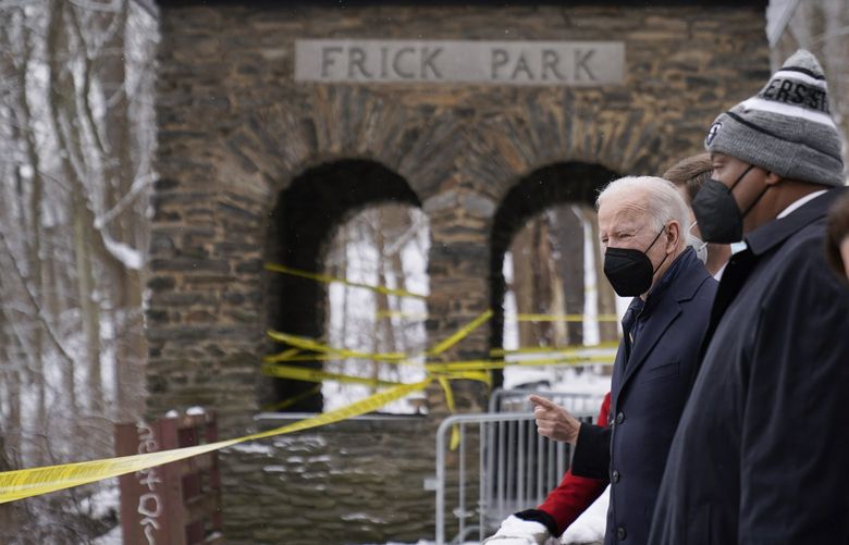 President Joe Biden visits the site where the Fern Hollow Bridge bridge collapsed Friday, Jan. 28, 2022, in Pittsburgh’s East End. (AP Photo/Andrew Harnik) PAAH413 PAAH413