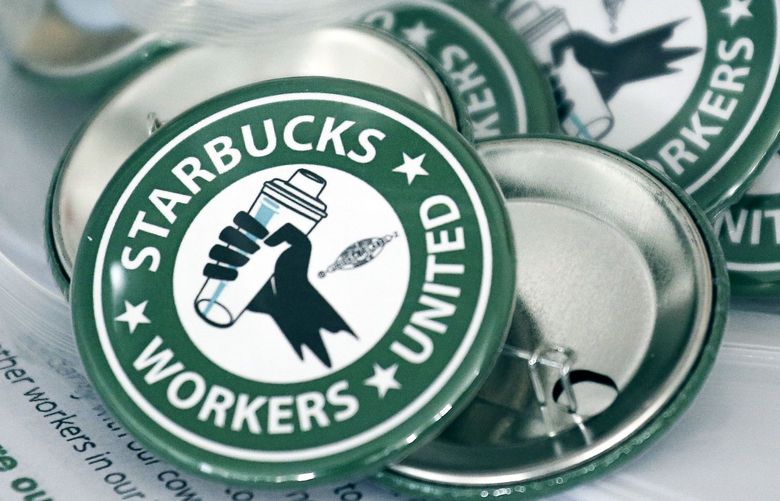 FILE – Pro-union pins for Starbucks’ employees union election, Dec. 9, 2021, in Buffalo, N.Y. (AP Photo/Joshua Bessex, File) 