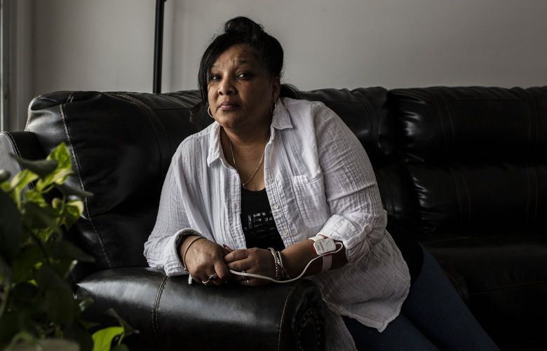 Regina Perez at her home in Allentown, Penn., Jan. 25, 2022. Perez, 57, had never been hospitalized for her lifelong asthma condition until she came down with COVID-19 this month. (Bryan Anselm/The New York Times)
