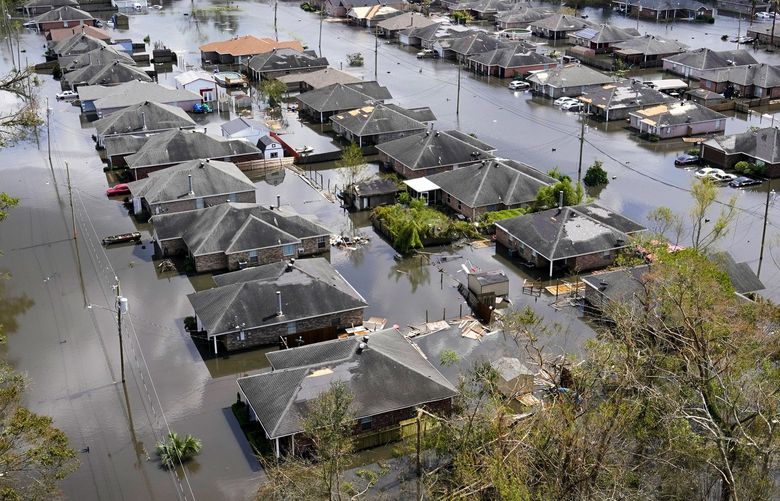 Homes are flooded in the aftermath of Hurricane Ida in LaPlace, La., Tuesday, Aug. 31, 2021. (AP Photo/Gerald Herbert) LACC164 LACC164