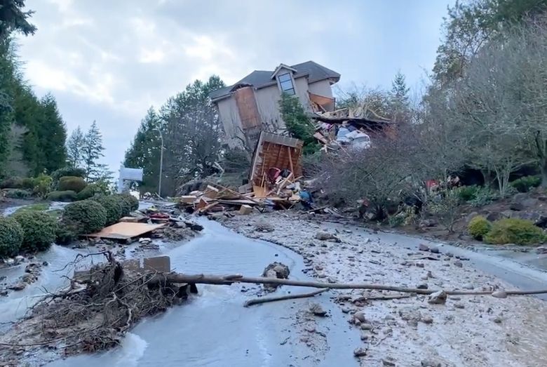 A Bellevue home slid off its foundation and partially collapsed Monday. Bellevue police said water gushed down a hillside from an unknown source. (Bellevue Police Department) (Bellevue Police Department / )