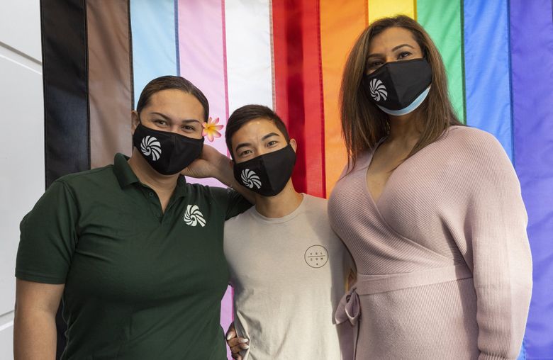 From left, Tepatasi Vaina, programs director; Jaron Goto, communications director; and Diana Krishna, wellness navigator, are transgender people working at UTOPIA, a community organization in Kent focused on helping transgender people of color, particularly Native Hawaiian and Pacific Islanders in Washington state. (Ellen M. Banner / The Seattle Times)