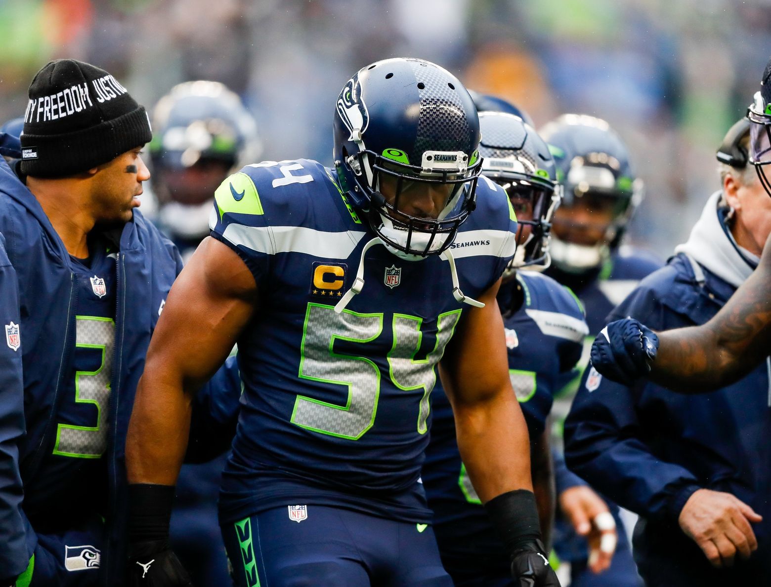 Fan on field tackled by Bobby Wagner claims he suffered concussion