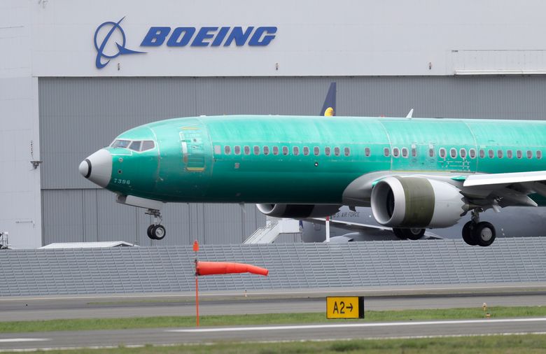 A Boeing 737 MAX 8 airplane lands following a test flight at Boeing Field in Seattle in April 2019. (AP Photo/Ted S. Warren, File)