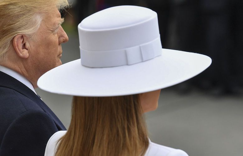 President Donald Trump and first lady Melania Trump wait for the arrival of French President Emmanuel Macron and his wife, Brigitte, at the White House in 2018. MUST CREDIT: Washington Post photo by Ricky Carioti.