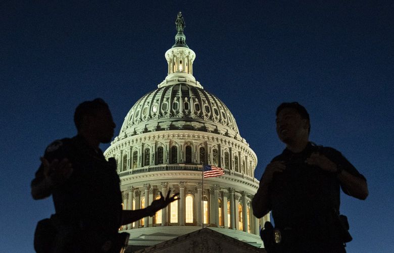 U.S. Capitol Police officers stand guard Sept. 27 on Capitol Hill. MUST CREDIT: Washington Post photo by Jabin Botsford