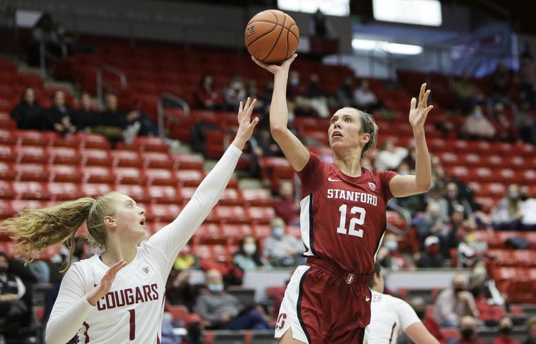 Stanford guard Lexie Hull (12) shoots over Washington State guard Tara Wallack (1) during the second half of an NCAA college basketball game, Sunday, Jan. 2, 2022, in Pullman, Wash. Stanford won 82-44. (AP Photo/Young Kwak) WAYK115 WAYK115