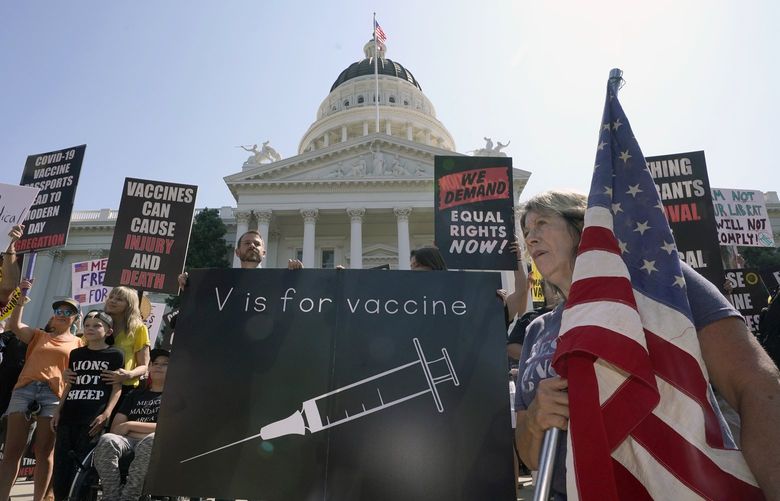 FILEâ€”Protesters opposing vaccine mandates gather at the Capitol in Sacramento, Calif., Wednesday, Sept. 8, 2021. State Sen. Scott Wiener, D-San Francisco, is introducing, Friday, Jan. 21, 2022 a bill that would allow children age 12 and up to be vaccinated without their parents consent. (AP Photo/Rich Pedroncelli, File) SC406 SC406