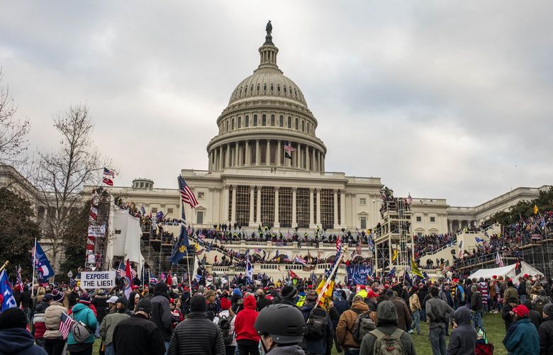 FILE — The mob at the U.S. Capitol in Washington on Jan. 6, 2021. The anniversary of the Jan. 6 riot arrives this week with the congressional committee investigating the attack confronting a series of difficult questions, including how forcefully to flex its subpoena power and whether the Supreme Court will stymie a major element of its inquiry.  (Jason Andrew/The New York Times) XNYT72 XNYT72