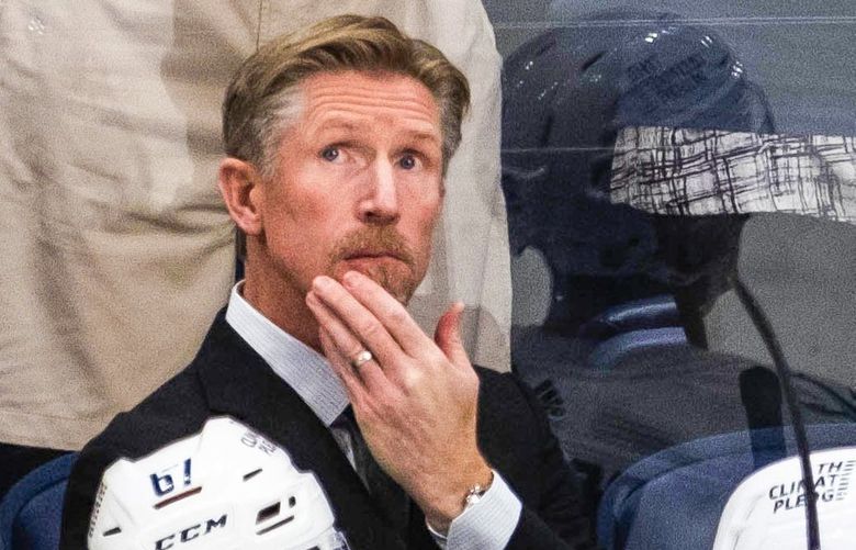 Kraken head coach Dave Hakstol looks at the scoreboard when Nashville ties the game in the 2nd period.
.
The Seattle Kraken played the Nashville Predators at Bridgestone Arena in Nashville, TN, Thursday, October 21, 2021. 218517 218517