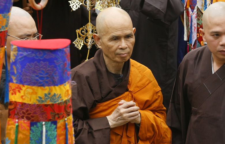FILE – Vietnamese Zen master Thich Nhat Hanh, center, arrives for a great chanting ceremony at Vinh Nghiem Pagoda in Ho Chi Minh City, Vietnam on March 16, 2007. Zen Buddhist monk Thich Nhat Hanh, who helped pioneer the concept of mindfulness in the West and socially engaged Buddhism in the East, has died at age 95 on Saturday, Jan. 22, 2022, according to an announcement on his verified Twitter page. (AP Photo, File) TKMY101 TKMY101