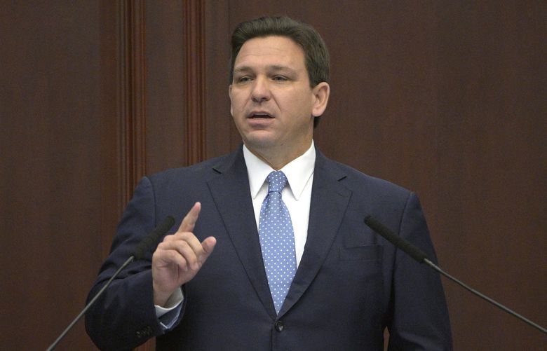 FILE – Florida Gov. Ron DeSantis addresses a joint session of a legislative session, Jan. 11, 2022, in Tallahassee, Fla. Trump is slamming politicians who refuse to say whether theyâ€™ve received COVID-19 booster shots, calling them â€œgutless.â€ In an interview with One America News Network on Tuesday night, he said unnamed politicians have been afraid to admit they got the booster shot. Trump did not name names, but Florida Gov. Ron DeSantis, who is often mentioned as a possible 2024 presidential contender, has notably declined to say whether he has received a booster.  (AP Photo/Phelan M. Ebenhack, File) FLPE102 FLPE102