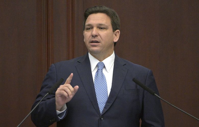 FILE – Florida Gov. Ron DeSantis addresses a joint session of a legislative session, Jan. 11, 2022, in Tallahassee, Fla. Trump is slamming politicians who refuse to say whether they’ve received COVID-19 booster shots, calling them “gutless.†In an interview with One America News Network on Tuesday night, he said unnamed politicians have been afraid to admit they got the booster shot. Trump did not name names, but Florida Gov. Ron DeSantis, who is often mentioned as a possible 2024 presidential contender, has notably declined to say whether he has received a booster. (AP Photo/Phelan M. Ebenhack, File) FLPE102 FLPE102