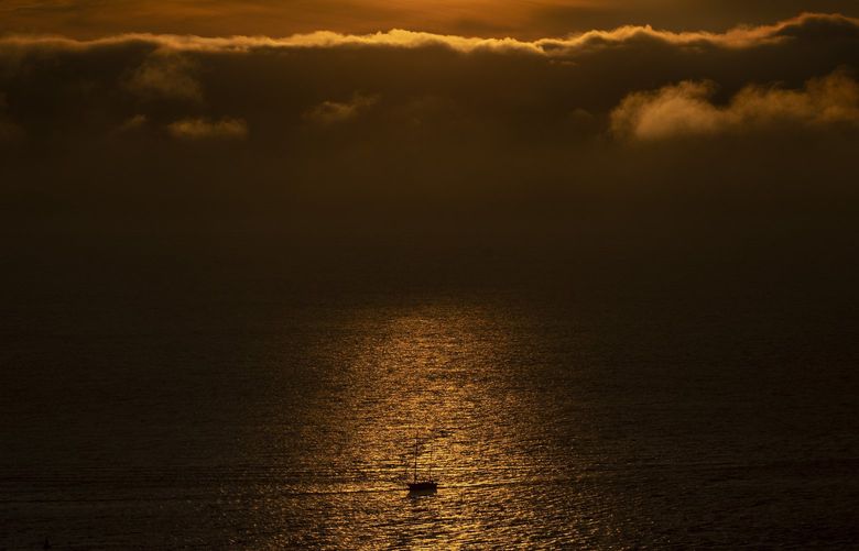 A boat moves along Shilshole Bay as the fog fades and the sun sets from Sunset Hill Park on Tuesday, Jan. 25, 2025. 

Wednesday marks the first day of the year when the sun will set after 5 p.m. 


LO