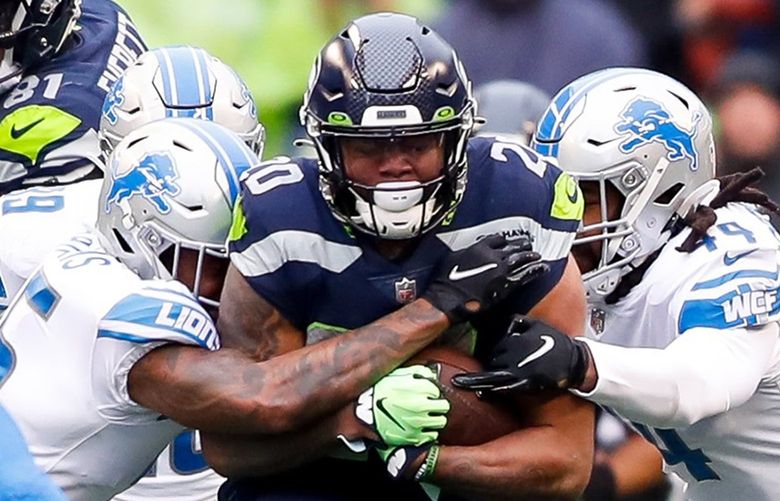 Lumen Field – Seattle Seahawks vs. Detroit Lions – 010222

Seattle Seahawks running back Rashaad Penny draws a crowd of Detroit Lions during the first quarter Sunday, Jan. 2, 2022, in Seattle, Wash. Penny had 170 yards rushing on the day.  219228