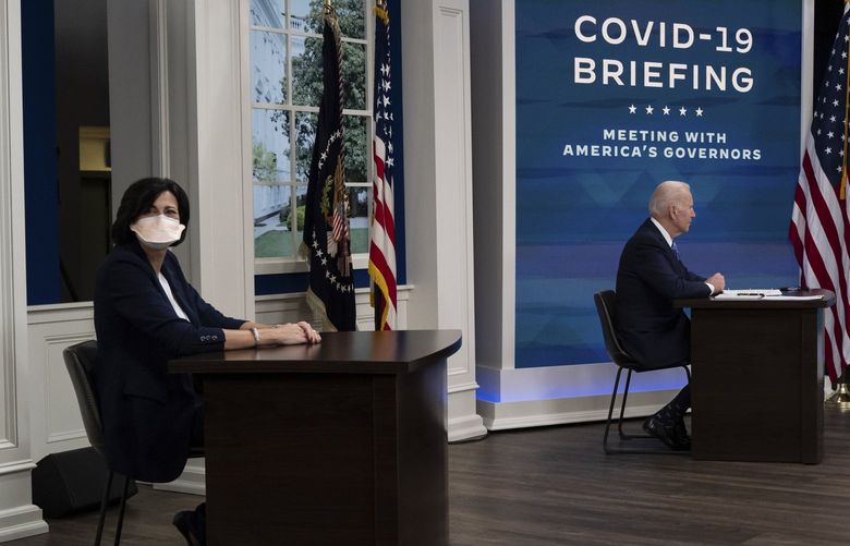 Dr. Rochelle Walensky, left, director of the Centers for Disease Control and Prevention, during a meeting with President Joe Biden and governors about the Covid-19 response in the White House in Washington, Dec. 27, 2021. Walensky has been criticized for failing to fully explain her reasoning for halving the recommended isolation period. (Cheriss May/The New York Times) XNYT136 XNYT136