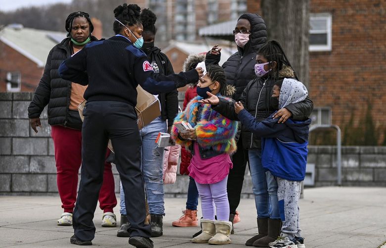 FILE – People wait in line to be tested for COVID-19 in Washington, Dec. 29, 2021. The official in charge of President Biden’s coronavirus response team expressed optimism on Friday about the future of the pandemic, saying the nation is “moving toward a time when Covid won’t disrupt our daily lives, where Covid won’t be a constant crisis but something we protect against and treat.” (Kenny HolstonThe New York Times) XNYT153 XNYT153