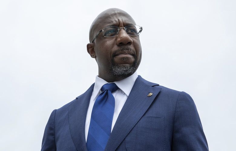 FILE – Sen. Raphael Warnock, D-Ga., speaks to reporters about voting rights legislation on Capitol Hill in Washington, Tuesday, Aug. 3, 2021.  Warnock’s campaign said Wednesday, Jan. 26, 2022,  that he raised a hefty $9.8 million in the last quarter of 2021, nearly double the fundraising haul reported by the leading Republican contender for his seat, former football star Herschel Walker. (AP Photo/Amanda Andrade-Rhoades) NY111 NY111