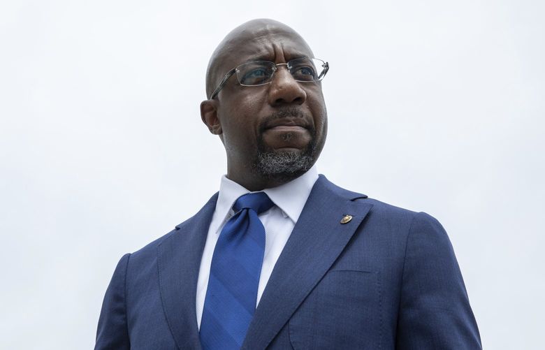 FILE – Sen. Raphael Warnock, D-Ga., speaks to reporters about voting rights legislation on Capitol Hill in Washington, Tuesday, Aug. 3, 2021. Warnock’s campaign said Wednesday, Jan. 26, 2022, that he raised a hefty $9.8 million in the last quarter of 2021, nearly double the fundraising haul reported by the leading Republican contender for his seat, former football star Herschel Walker. (AP Photo/Amanda Andrade-Rhoades) NY111 NY111