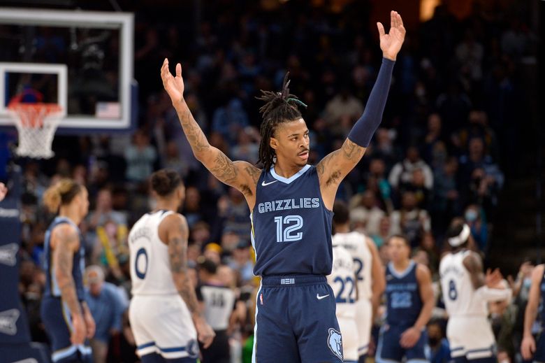 Ja Morant of the Memphis Grizzlies reacts to play against the