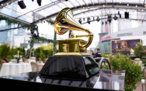 FILE – A decorative grammy is seen before the start of the 63rd annual Grammy Awards at the Los Angeles Convention Center on Sunday, March 14, 2021. The upcoming Grammy Awards have been postponed due to what organizers called “too many risks” due to the omicron variant. The ceremony had been scheduled for Jan. 31st in Los Angeles with a live audience and performances. (AP Photo/Chris Pizzello, File)