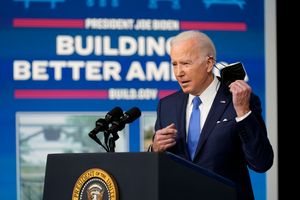 President Joe Biden begins to speak in the Eisenhower Executive Office Building on the White House Campus in Washington on Friday, Jan. 14. (AP Photo/Andrew Harnik)