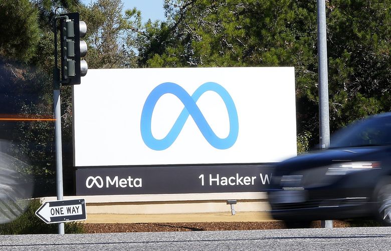 FILE – Facebook unveiled their new Meta sign at the company headquarters in Menlo Park, Calif., on Oct. 28, 2021.  (AP Photo/Tony Avelar, File) NYDD202 NYDD202