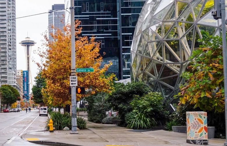 The Amazon Spheres, part of the Amazon headquarters campus, right, in the South Lake Union neighborhood of Seattle, Oct. 24, 2021.