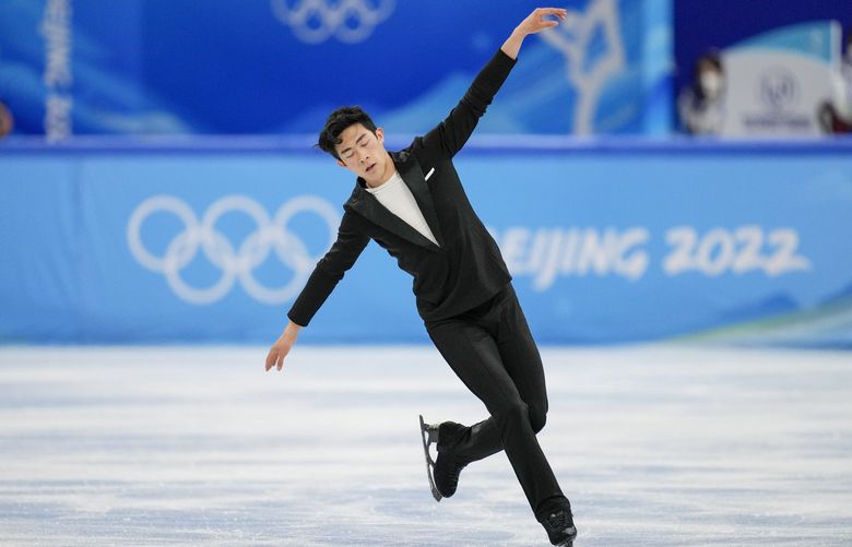 Nathan Chen, of the United States, competes during the men’s singles short program team event in the figure skating competition at the 2022 Winter Olympics, Friday, Feb. 4, 2022, in Beijing. (AP Photo/Bernat Armangue) OLYRR153 OLYRR153