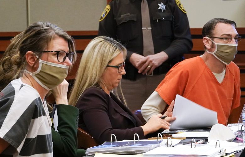 Jennifer Crumbley, left, and James Crumbley, right, the parents of Ethan Crumbley, a teenager accused of killing four students in a shooting at Oxford High School, appear in court for a preliminary examination on involuntary manslaughter charges in Rochester Hills, Mich., Tuesday, Feb. 8, 2022. (AP Photo/Paul Sancya) MIPS105 MIPS105