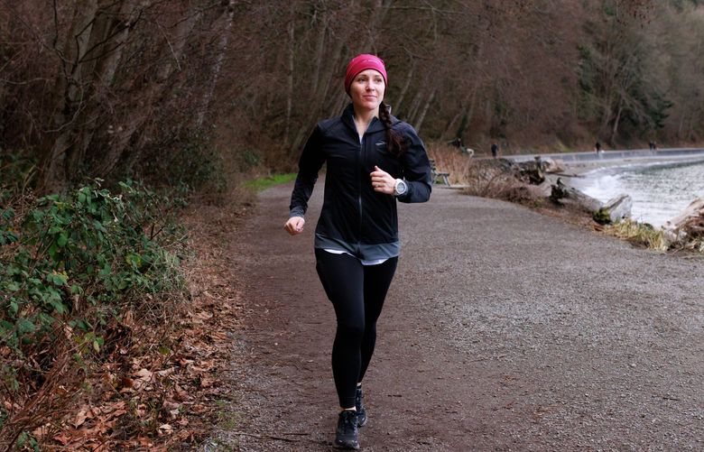 Kati Leigh, race director for Northwest Trail Runs and Brooks Running accountant, runs at Lincoln Park Tuesday, Feb. 8, 2022. Leigh regularly runs at the West Seattle park.  219537