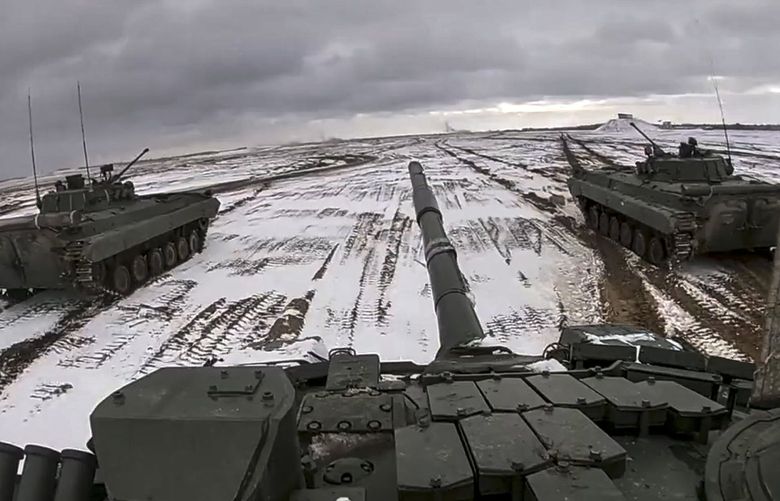 FILE – In this image from video released by the Russian Defense Ministry Press Service on Wednesday, Feb. 2, 2022, Russian and Belarusian armored vehicles drive during a joint military drills at Brestsky firing range, Belarus. Fears are rising about what would happen to Europe’s energy supply if Russia were to invade Ukraine and then shut off its natural gas in retaliation for U.S. and European sanctions. (Russian Defense Ministry Press Service via AP, File) XAZ902 XAZ902