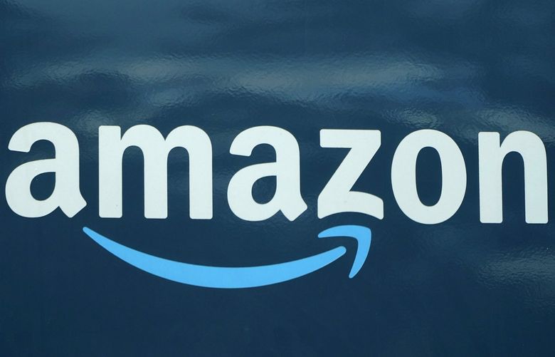 FILE – An Amazon logo appears on a delivery van, Oct. 1, 2020, in Boston. Amazon is reporting, Thursday, Feb. 3, 2022, strong fourth-quarter sales and profits even as the online behemoth continues to contend with surging costs tied to a snarled supply chain and labor shortages. (AP Photo/Steven Senne, File) NYPS211 NYPS211