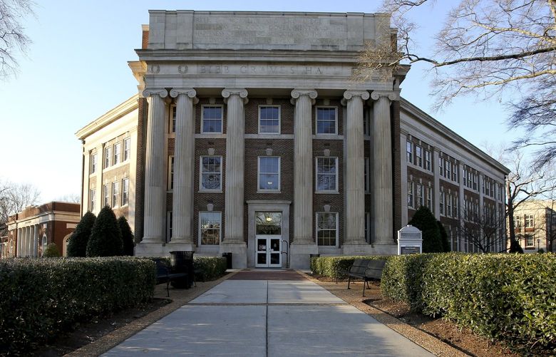 Bibb Graves Hall, seen on the campus of the University of Alabama in Tuscaloosa, Ala., on Thursday, Feb. 10, 2022. The University of Alabama is reconsidering its decision last week to retain the name of a one-time governor who led the Ku Klux Klan on a campus building while adding the name of the school’s first Black student. Trustees will meet publicly in a livestreamed video conference on Friday, Feb. 11, 202, to revisit their decision to keep the name of former Alabama Gov. Bibb Graves on a three-story hall while renaming it Lucy-Graves Hall to also honor Autherine Lucy Foster, the University of Alabama System said.  (Gary Cosby Jr./The Tuscaloosa News via AP) ALTUS304 ALTUS304