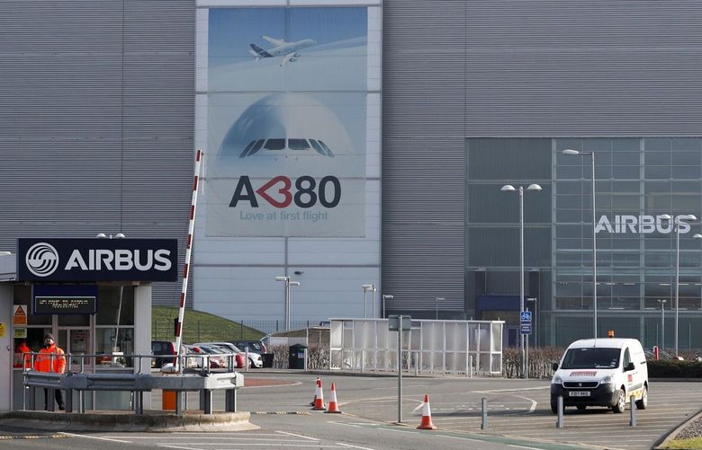 Security officers stand at the gatehouse outside the Airbus plant in Broughton, U.K., on Thursday.