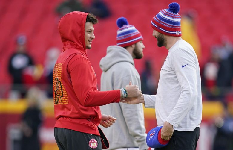 Kansas City Chiefs quarterback Patrick Mahomes, left, greets Buffalo Bills quarterback Josh Allen, right, before an NFL divisional round playoff football game, Sunday, Jan. 23, 2022, in Kansas City, Mo. (AP Photo/Ed Zurga)